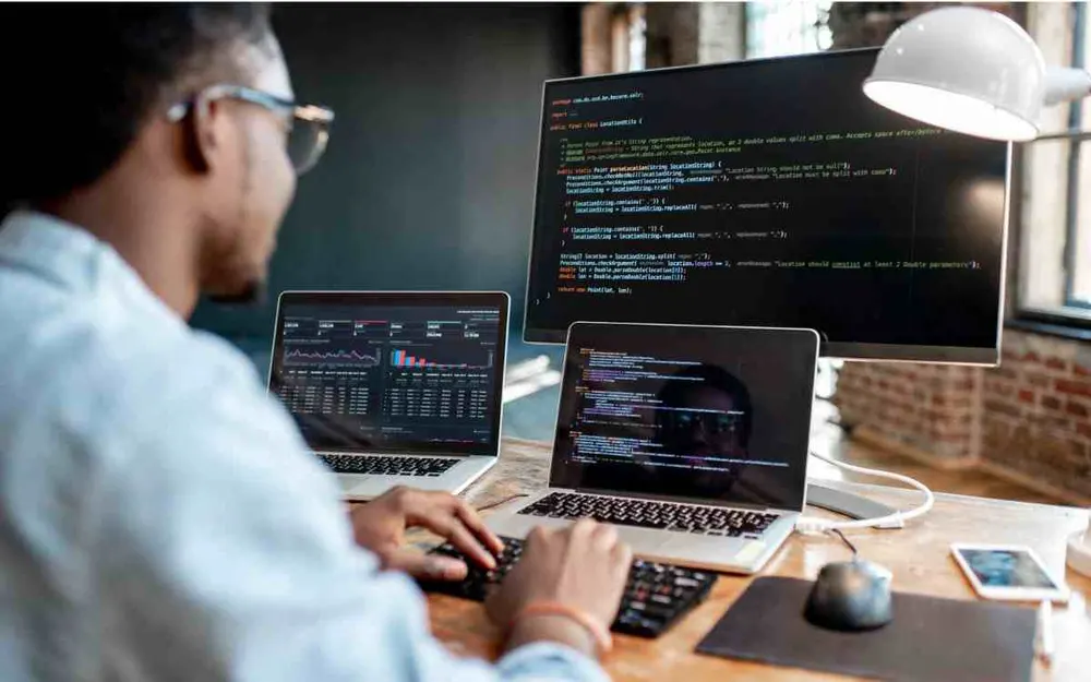 Laptop showing code on a desk